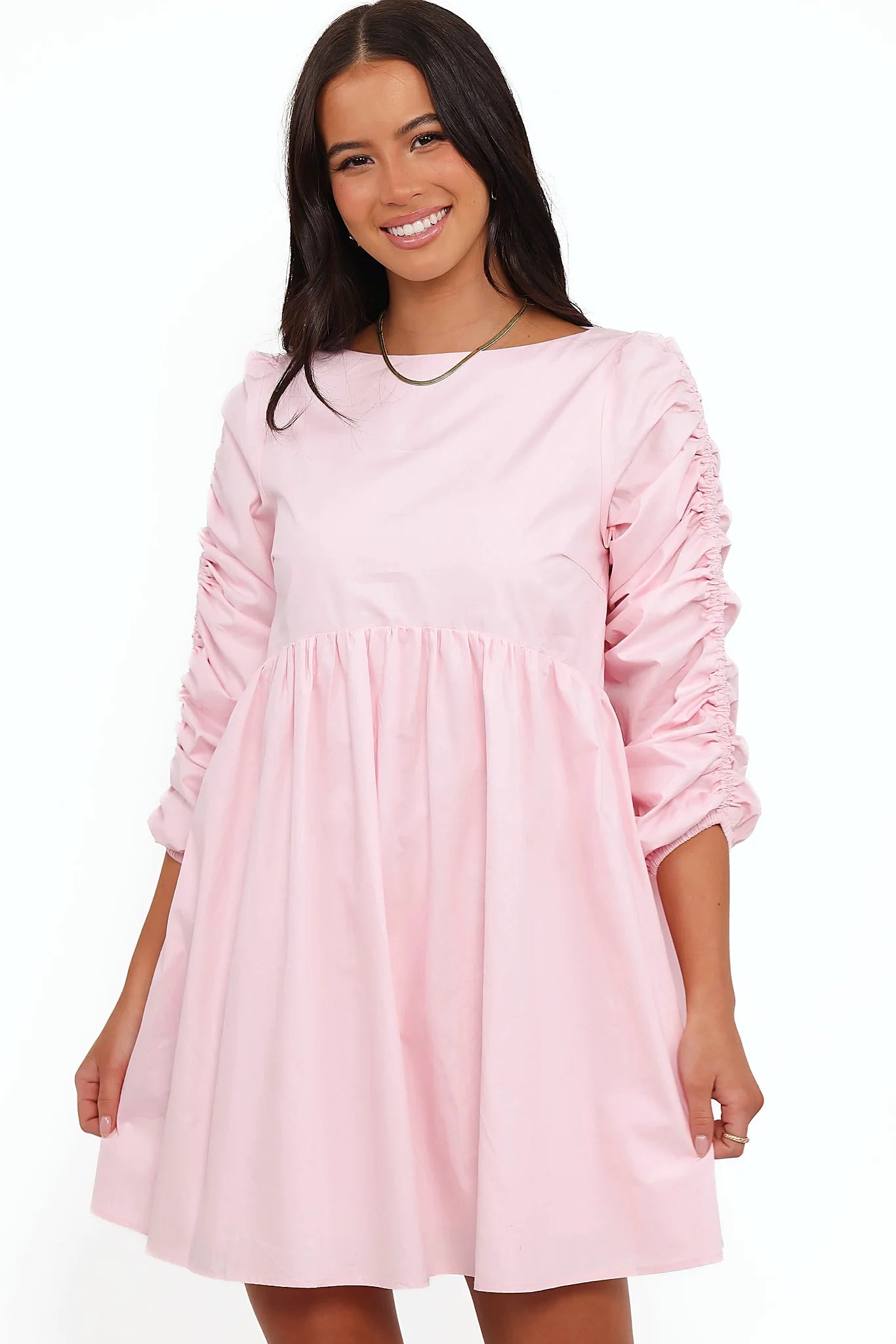 Full-length view of the pink smock long sleeve mini dress