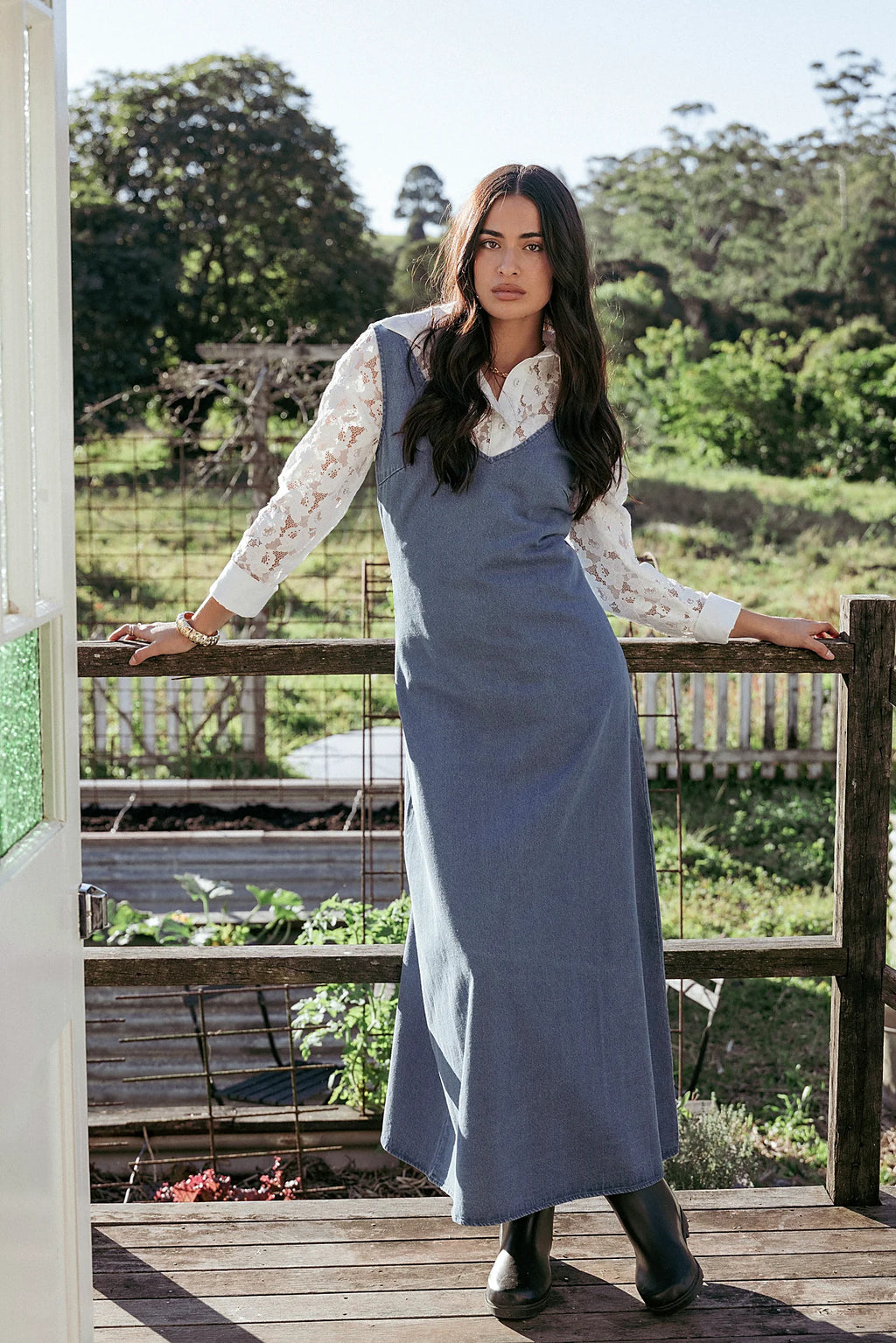 Side view showing the drape of the indigo denim maxi dress