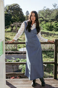 Side view showing the drape of the indigo denim maxi dress