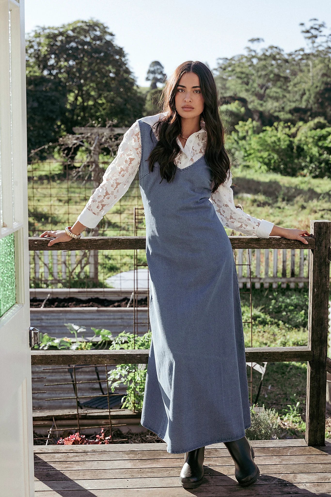 Side view showing the drape of the indigo denim maxi dress