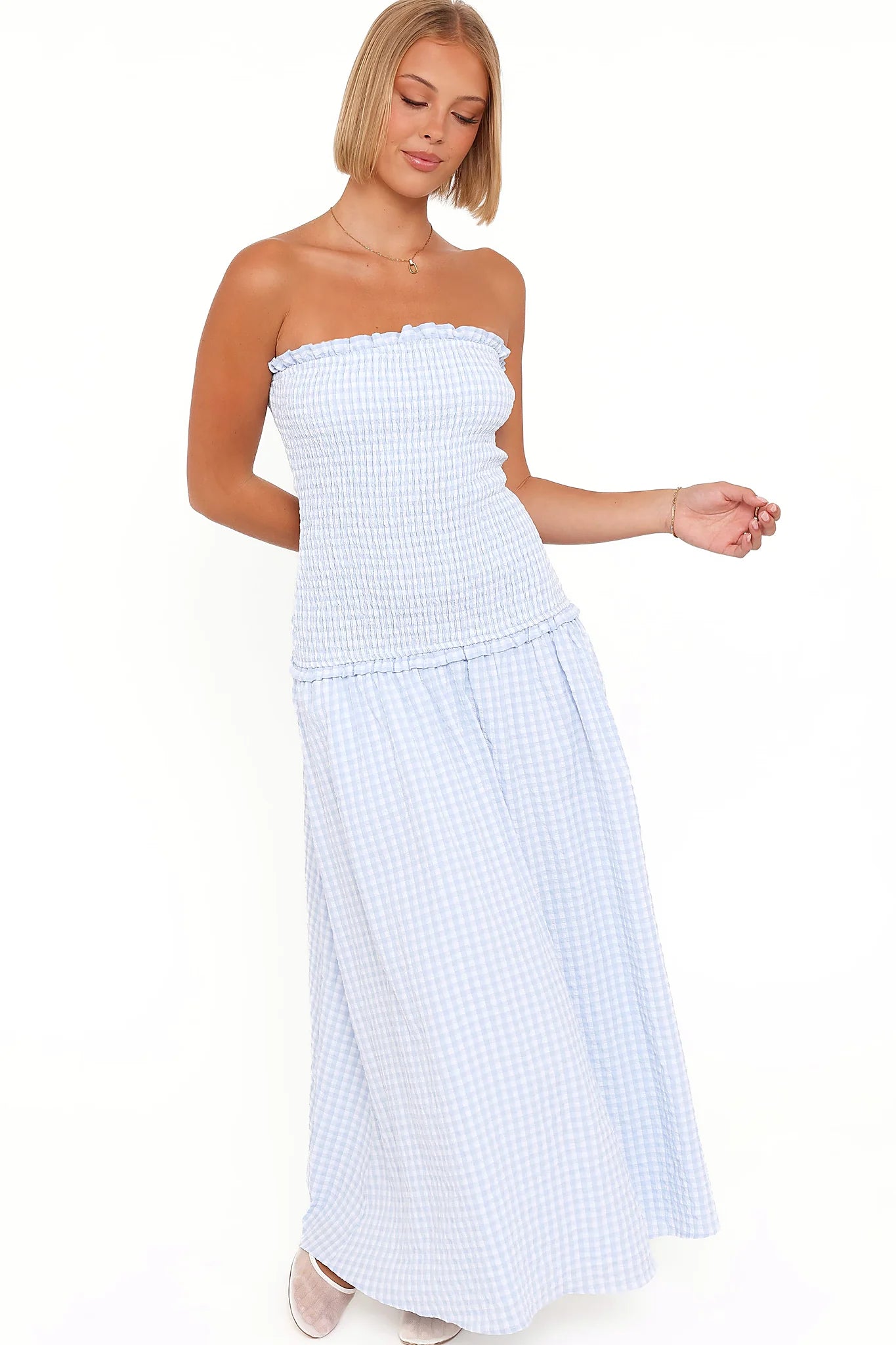 Full-length view of the blue gingham maxi dress