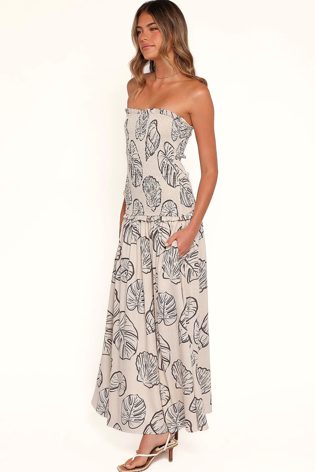 Close-up of the neckline of the cream shells maxi dress