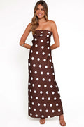 Close-up of the neckline of the brown polka dot strapless maxi dress