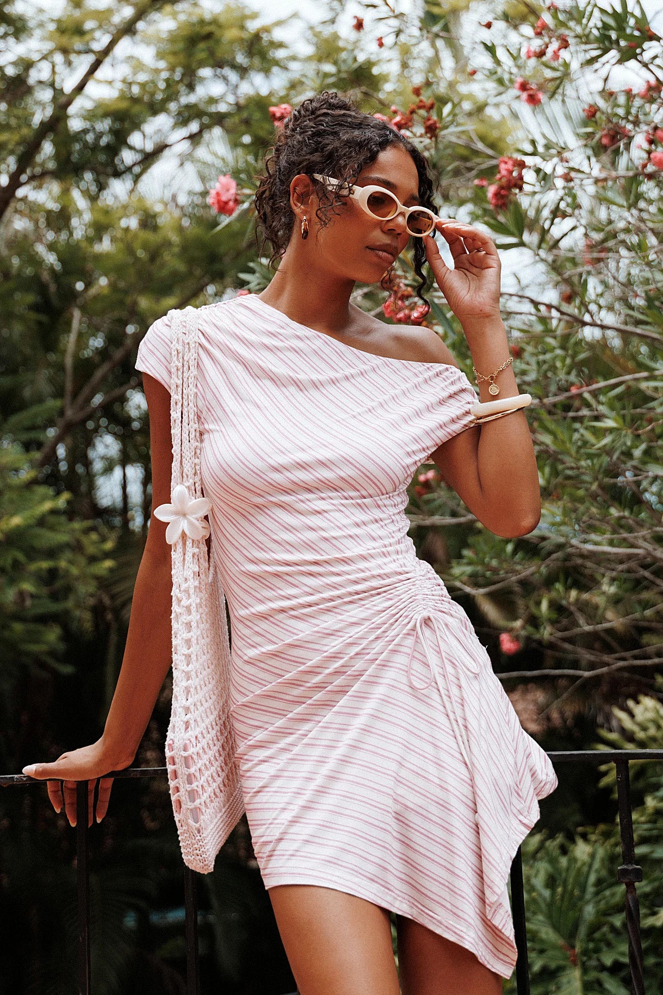Back view of the pink stripe mini dress on a model
