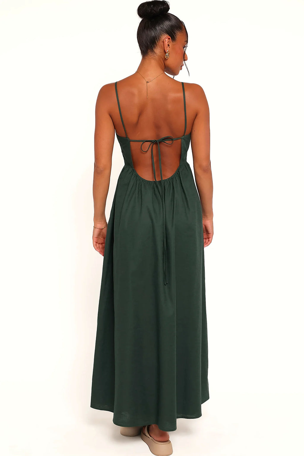 Model wearing the forest green maxi dress, front view