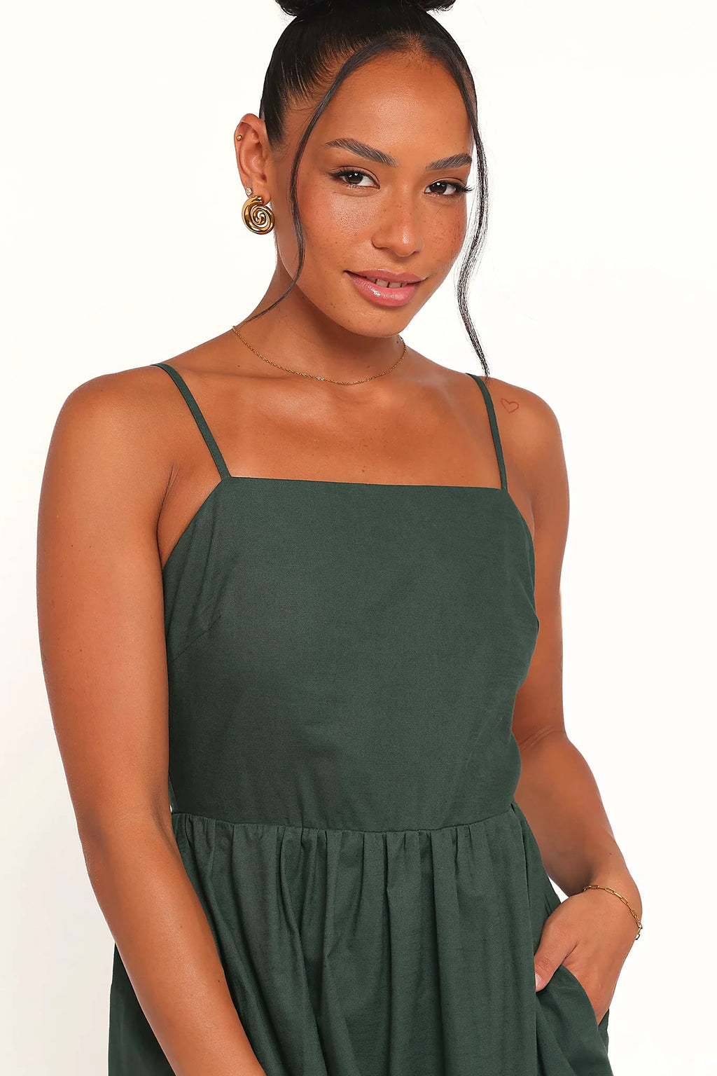 Back view of the forest green maxi dress on a model
