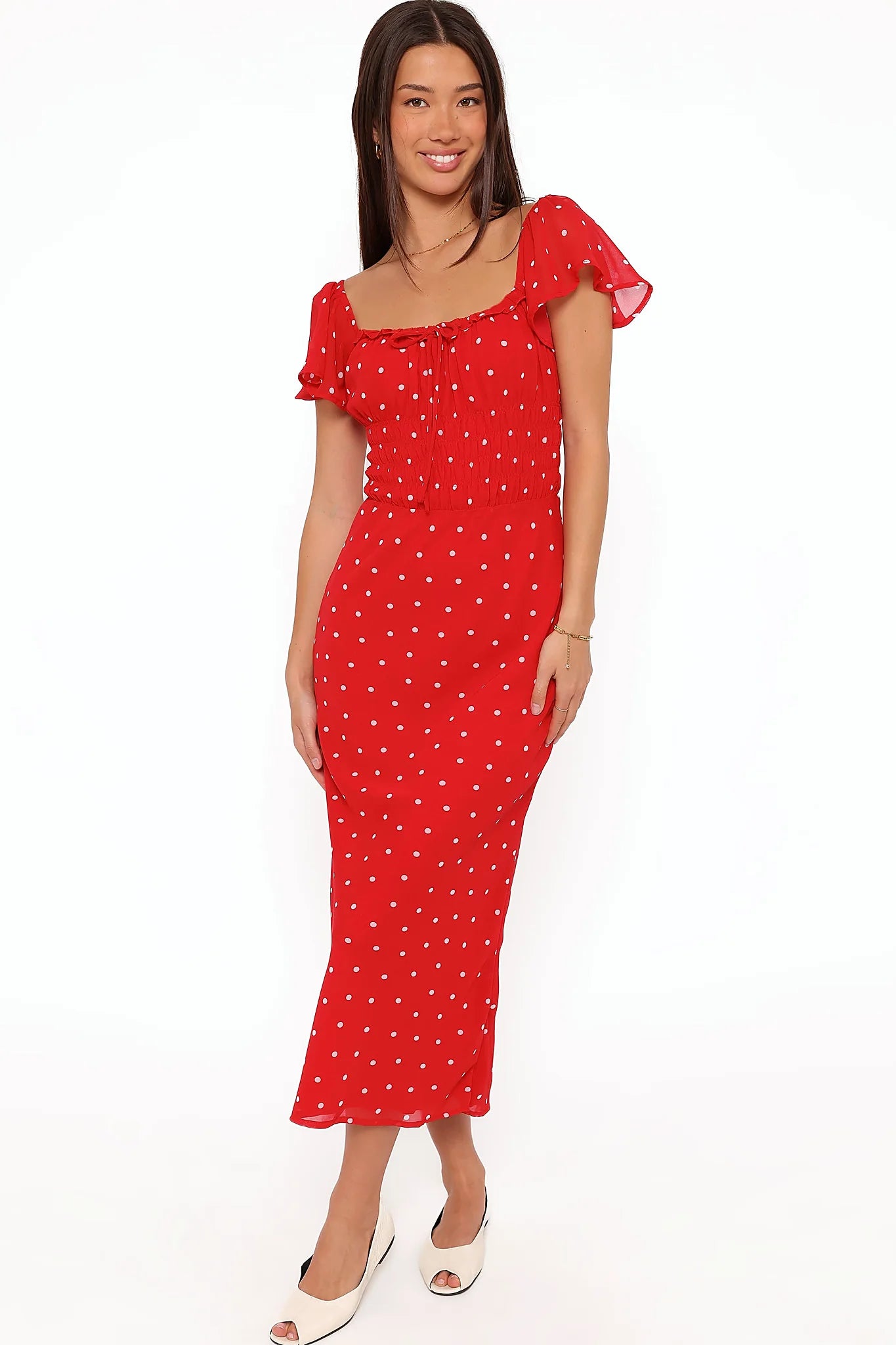 Detail view of the red polka dot maxi dress