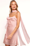Model wearing the peach rosette mini dress, front view