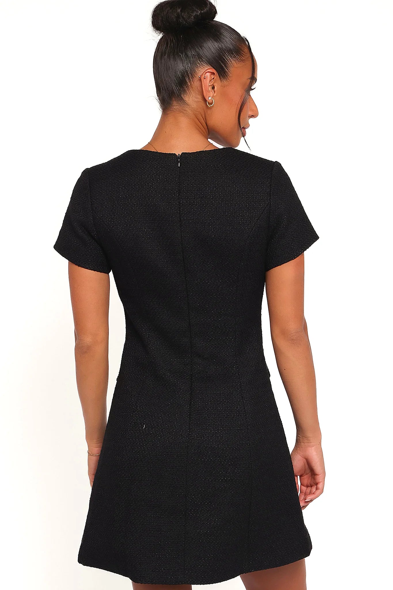 Full-length view of the black tweed mini dress