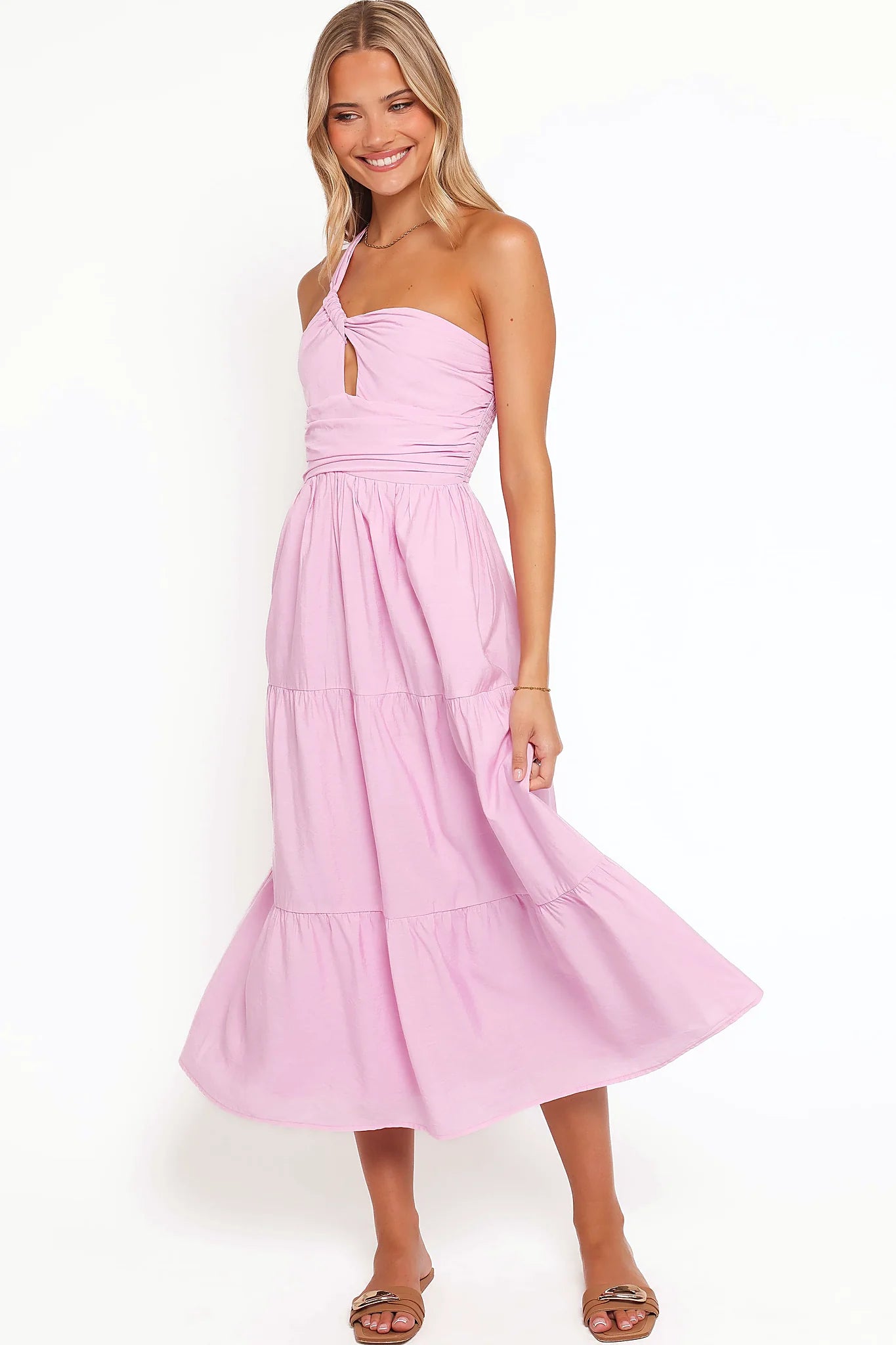 Back view of the pink one-shoulder tiered maxi dress on a model