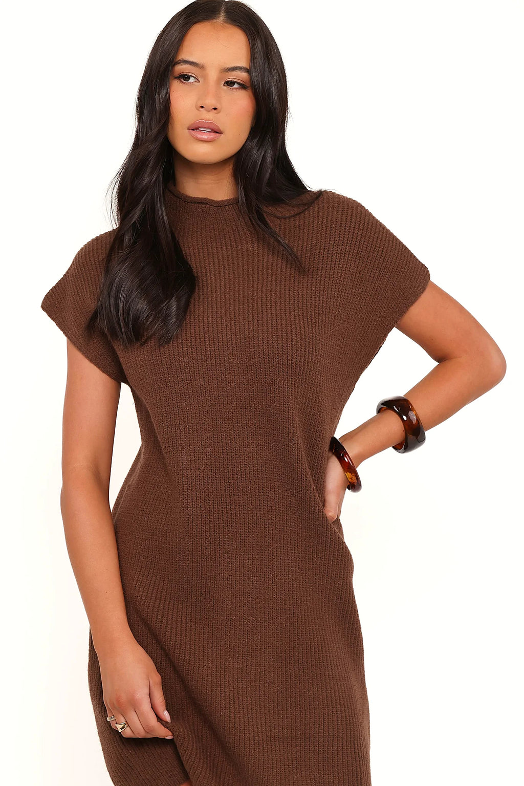 Model wearing the chocolate brown knit mini dress, front view