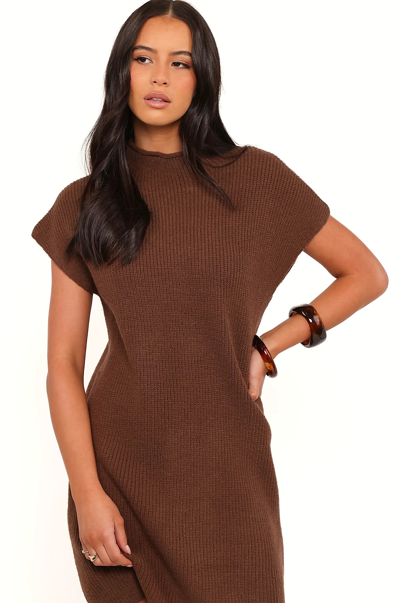Model wearing the chocolate brown knit mini dress, front view