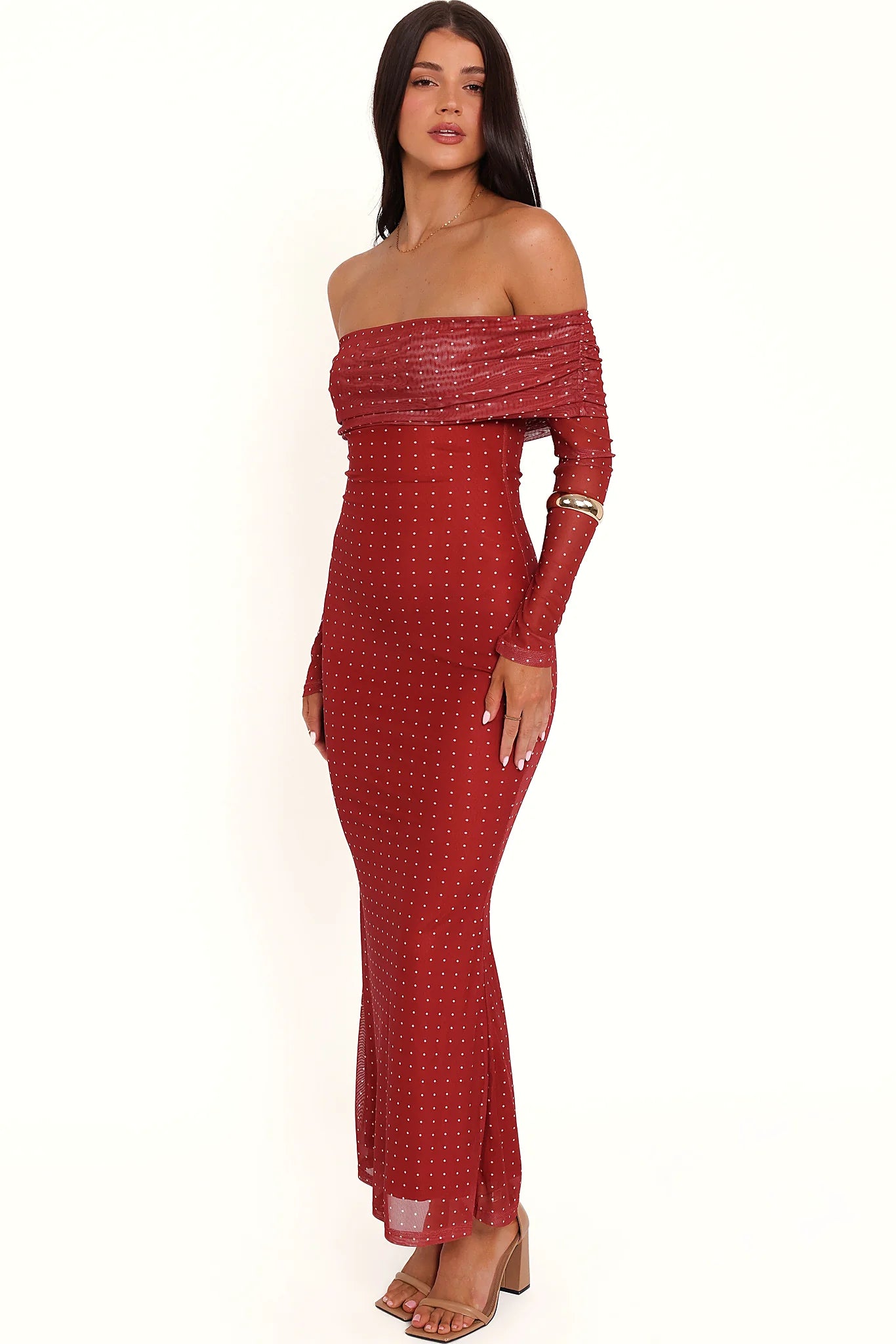 Detail view of the burgundy spot off-shoulder maxi dress